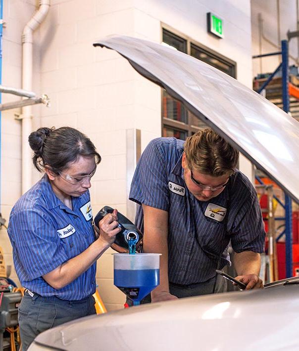 Students working on a car